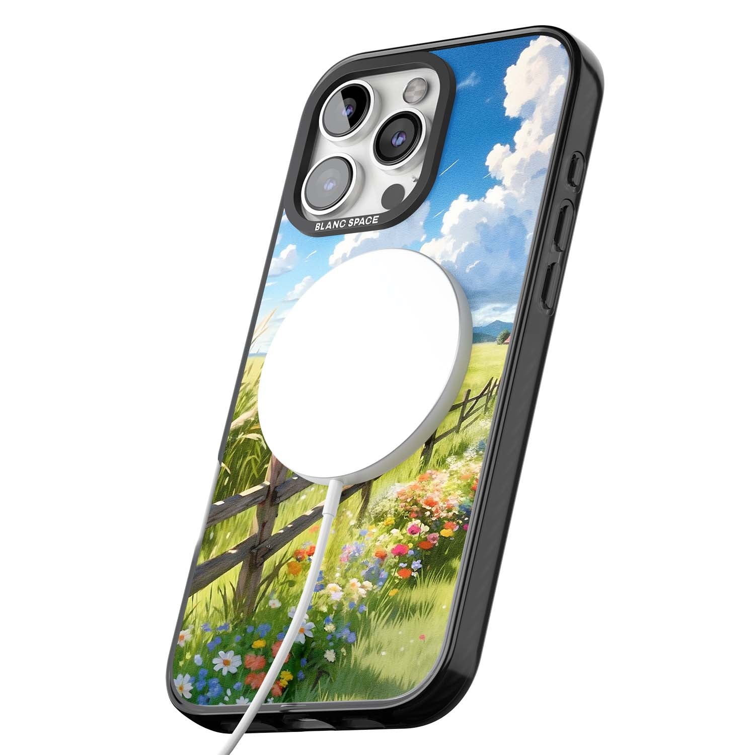 A Countryside Afternoon cottagecore iPhone case featuring a painted countryside meadow, wooden fence, and wildflowers beneath | Black Impact Magsafe case for iPhone 16 Pro, iPhone 16 Pro Max