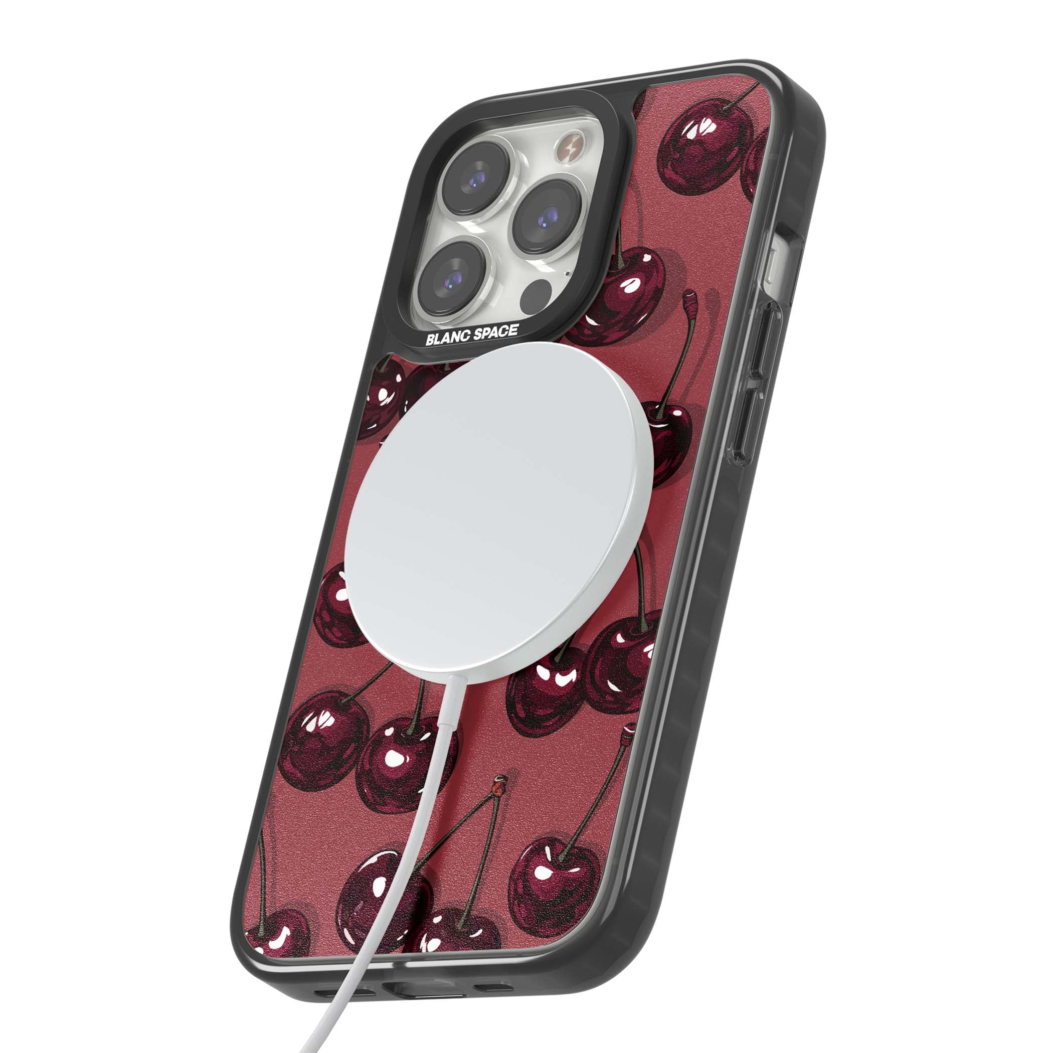 Cherry Rebel coquette iPhone case featuring glossy burgundy cherries on a dusty rose background | Black Impact Magsafe case for iPhone 13 Pro, iPhone 14 Pro, iPhone 15 Pro