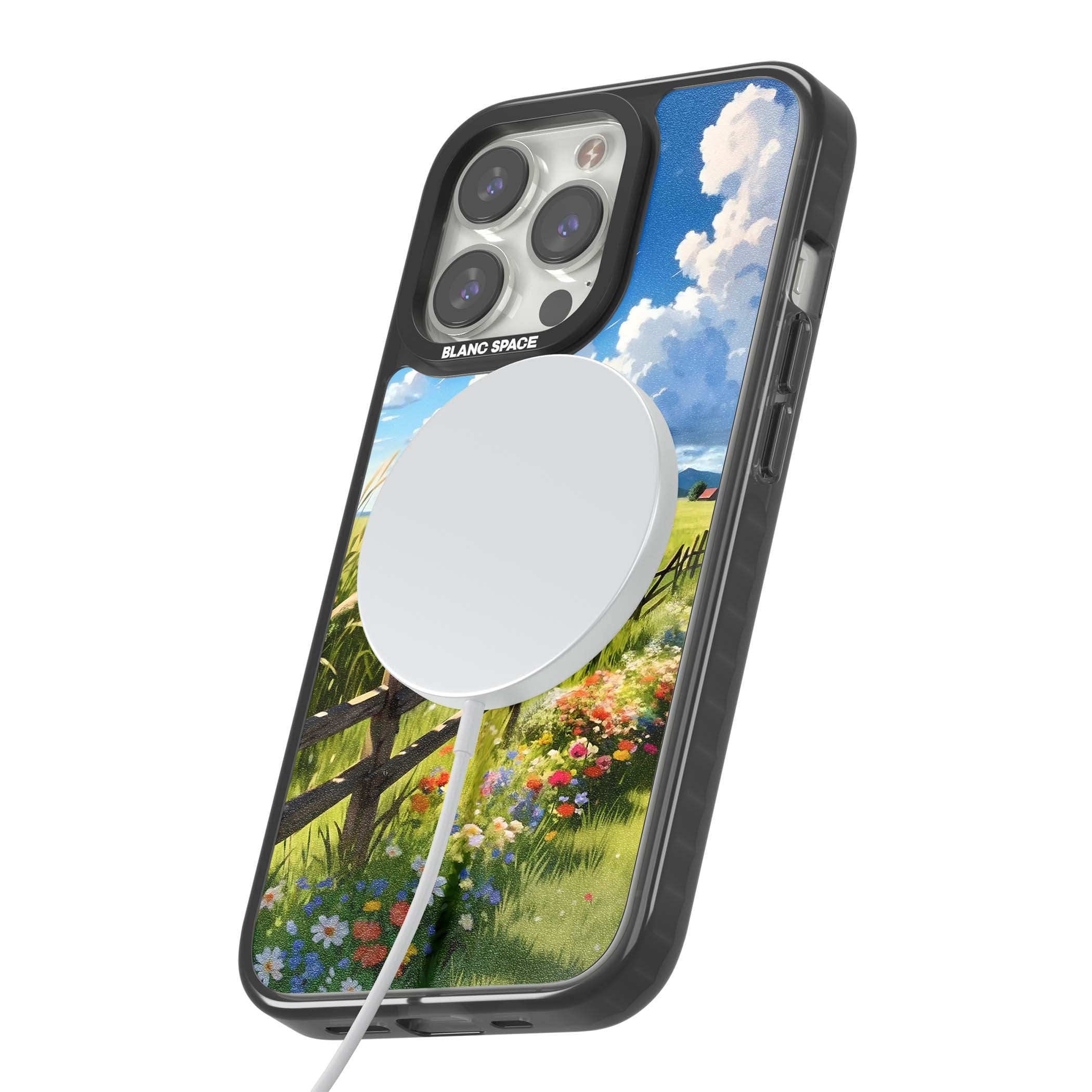 A Countryside Afternoon cottagecore iPhone case featuring a painted countryside meadow, wooden fence, and wildflowers beneath | Black Impact Magsafe case for iPhone 13 Pro, iPhone 14 Pro, iPhone 15 Pro