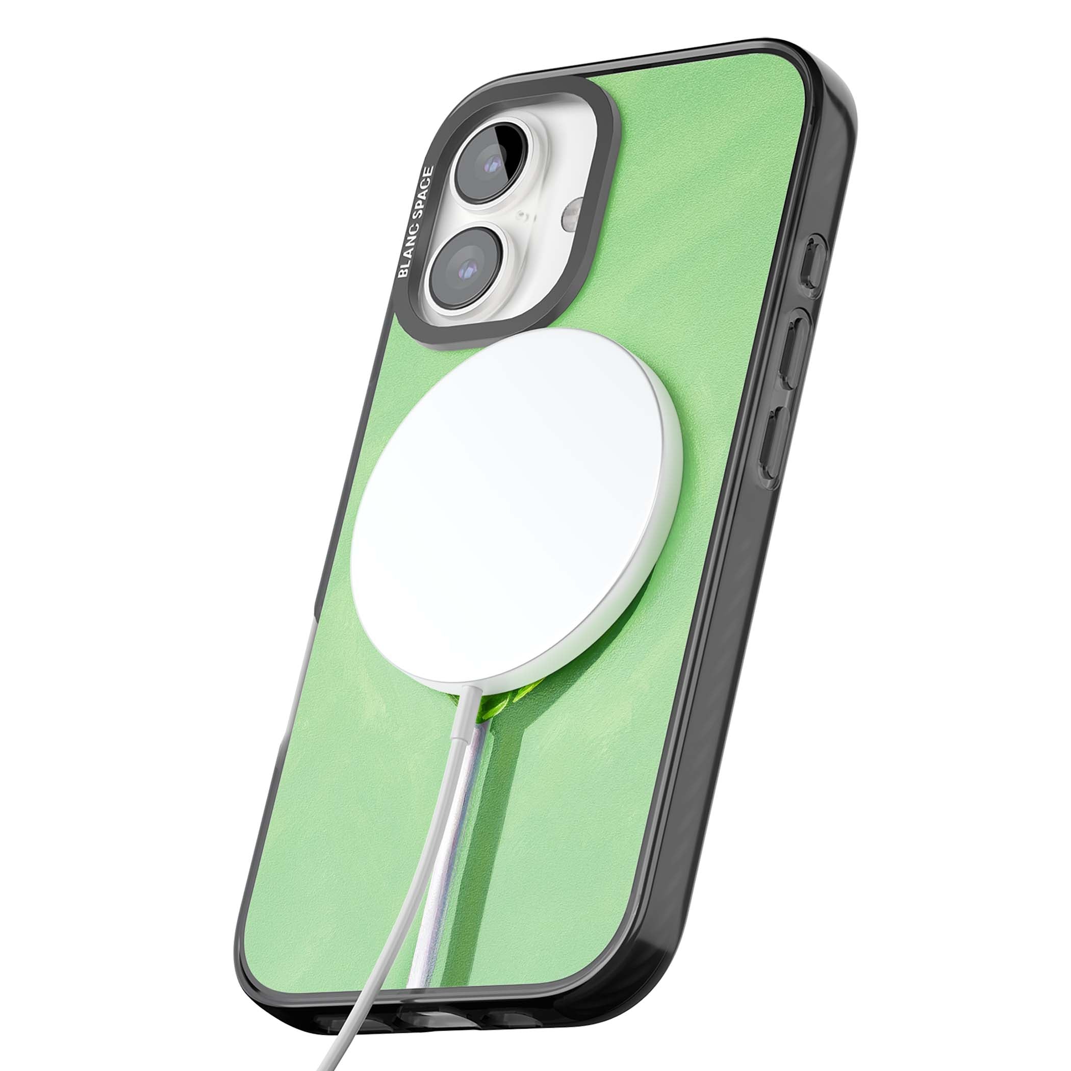 Green Lollipop candy art iPhone case featuring a glossy green heart-shaped lollipop on a painted pastel green background | Black Impact Magsafe case for iPhone 16, iPhone 16 Plus